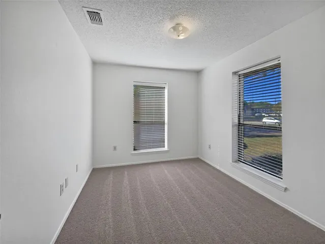 a view of a room with a hallway