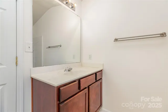 a bathroom with a sink and vanity