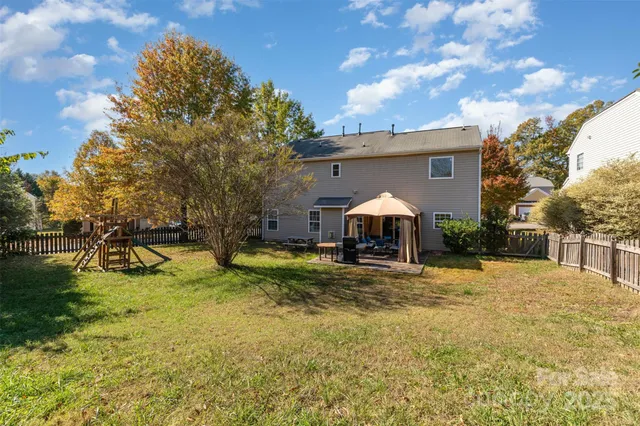 a view of a yard with a slide