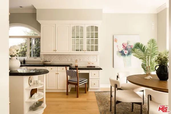 a kitchen with a table and chairs in it