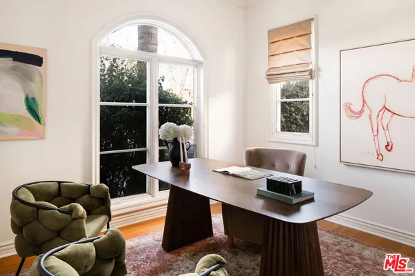 a workspace with furniture and window