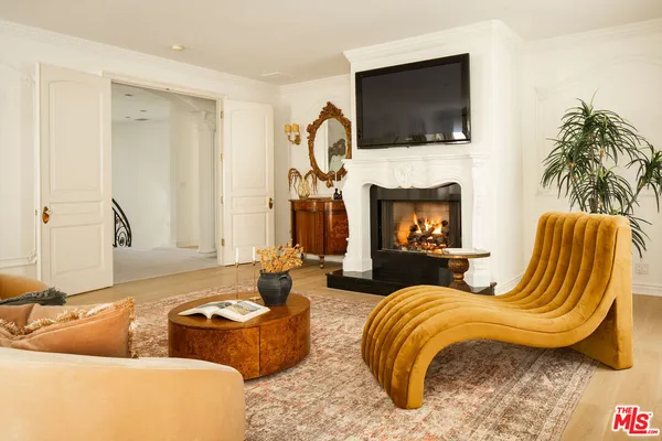 a living room with furniture or flat screen tv and a fireplace