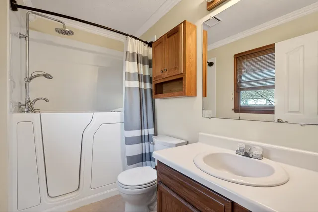 a view of a wooden deck with a bench