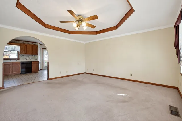 an empty room with a kitchen