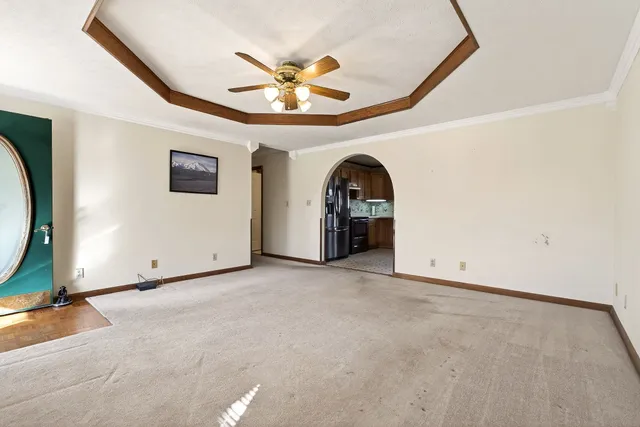 an empty room with projector and balcony