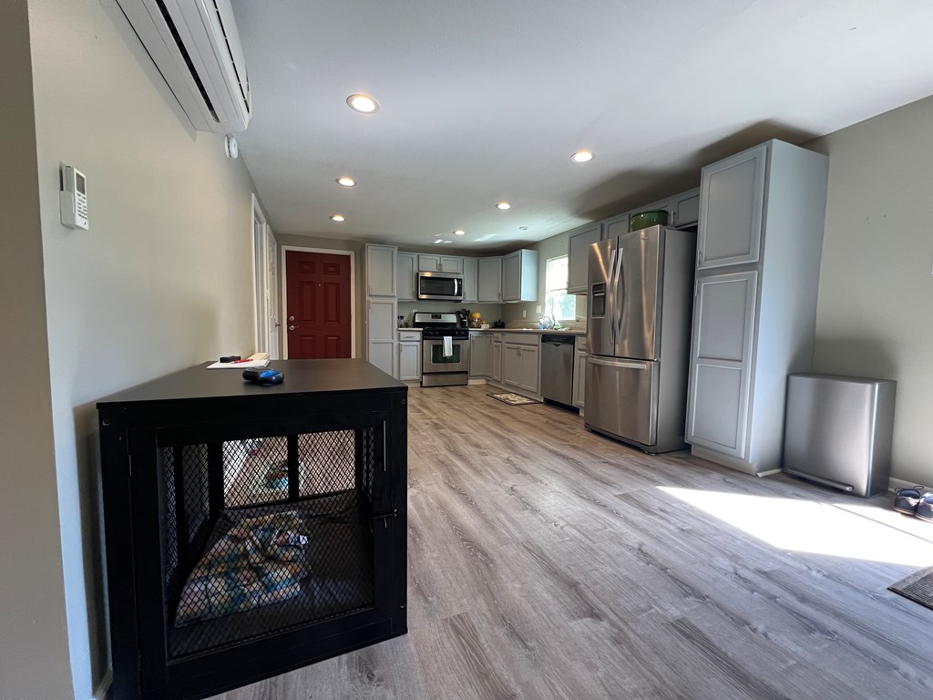 155 Cherry Run Road Rouseville, PA 16344 - Photo 7 of 19 a view of kitchen with refrigerator microwave and wooden floor
