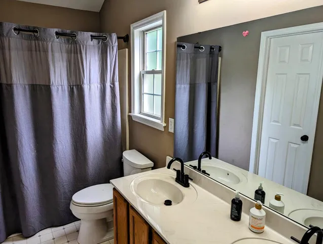 a bathroom with sink and mirror