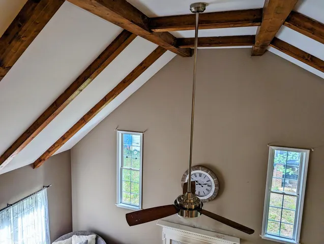 a view of a hallway with windows