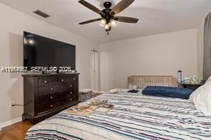 a view of a hallway with wooden cabinets