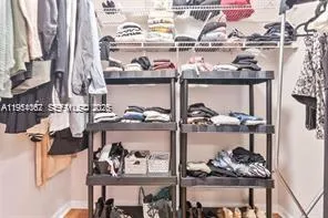 a bathroom with a bathtub sink vanity and mirror