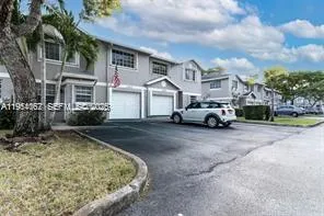 a view of swimming pool with outdoor seating and plants