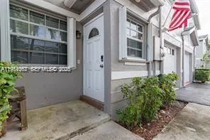 a view of a building with a small yard