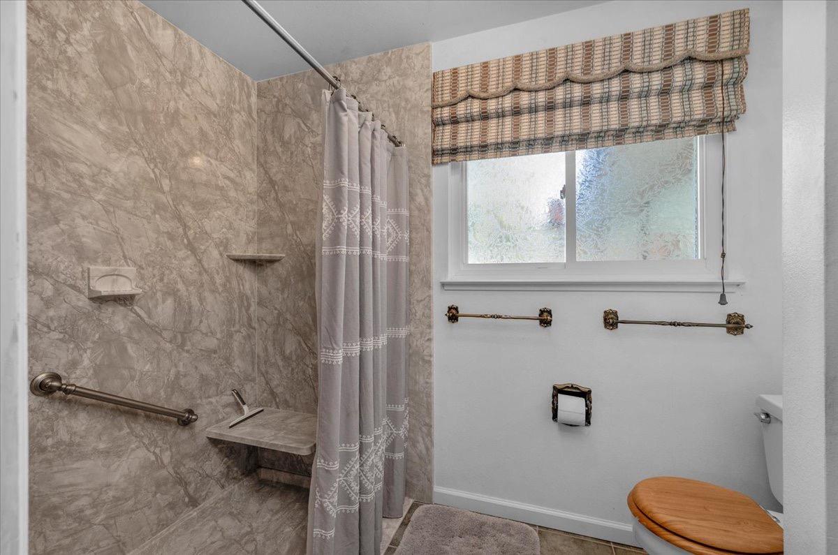 41071 Adobe Way Madera, CA 93636 - Photo 17 of 27 a bathroom with a toilet and a shower