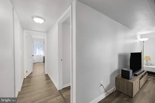 a view of a livingroom with an empty space and a window