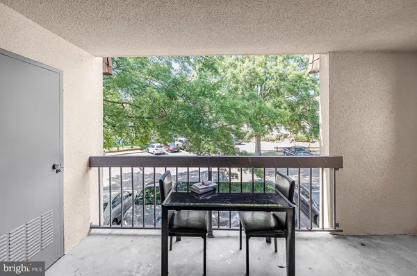 a view of a balcony with wooden floor