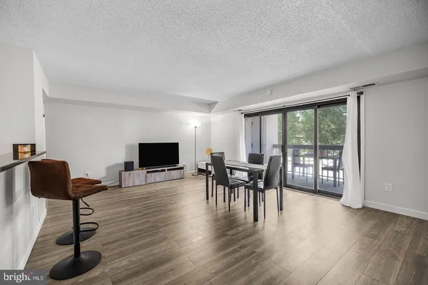 a view of a livingroom with furniture and a flat screen tv