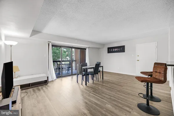 a view of a livingroom with furniture and a flat screen tv
