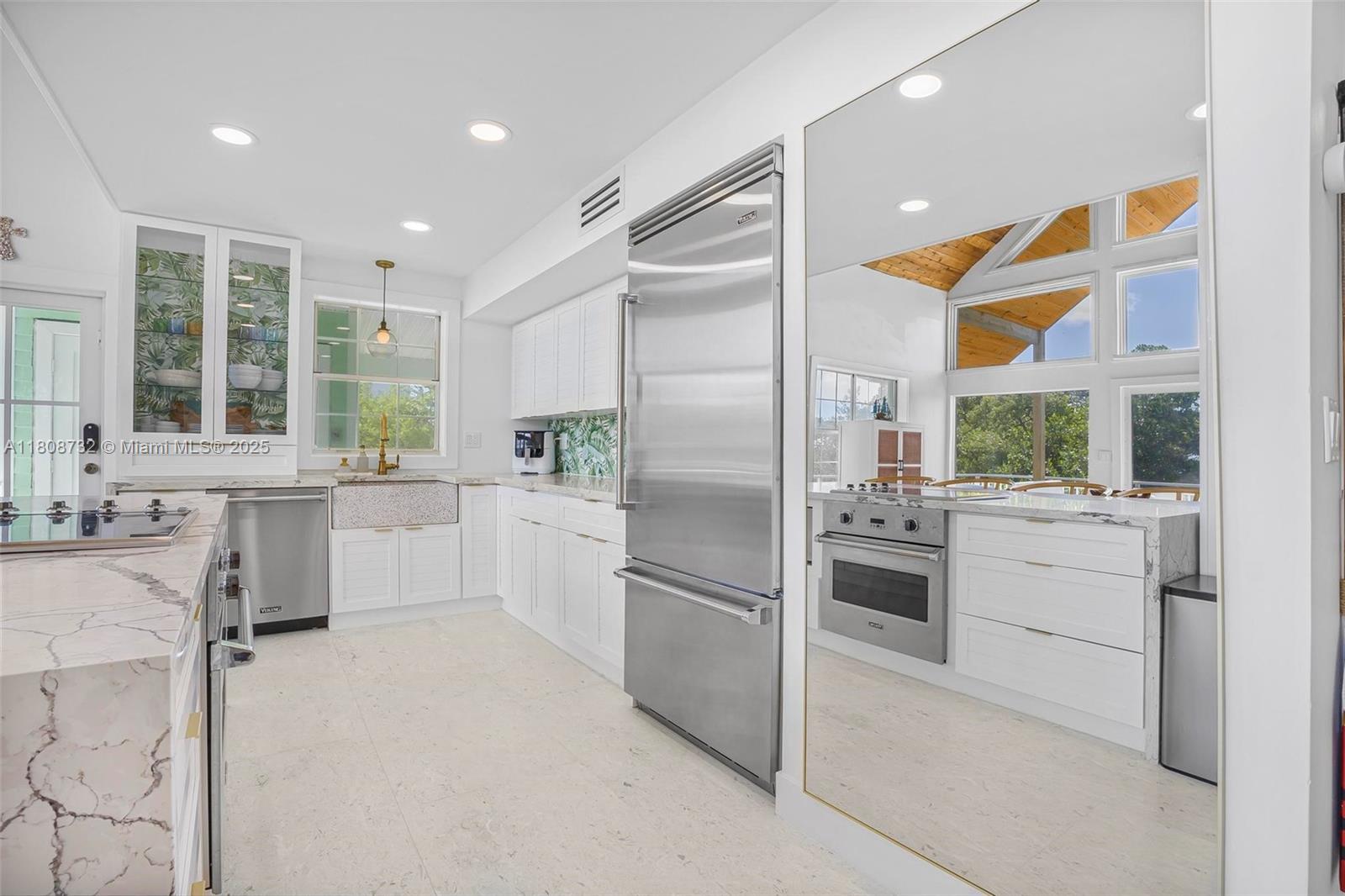 41 Mutiny Place Key Largo, FL 33037 - Photo 20 of 69 a kitchen with a refrigerator and a sink