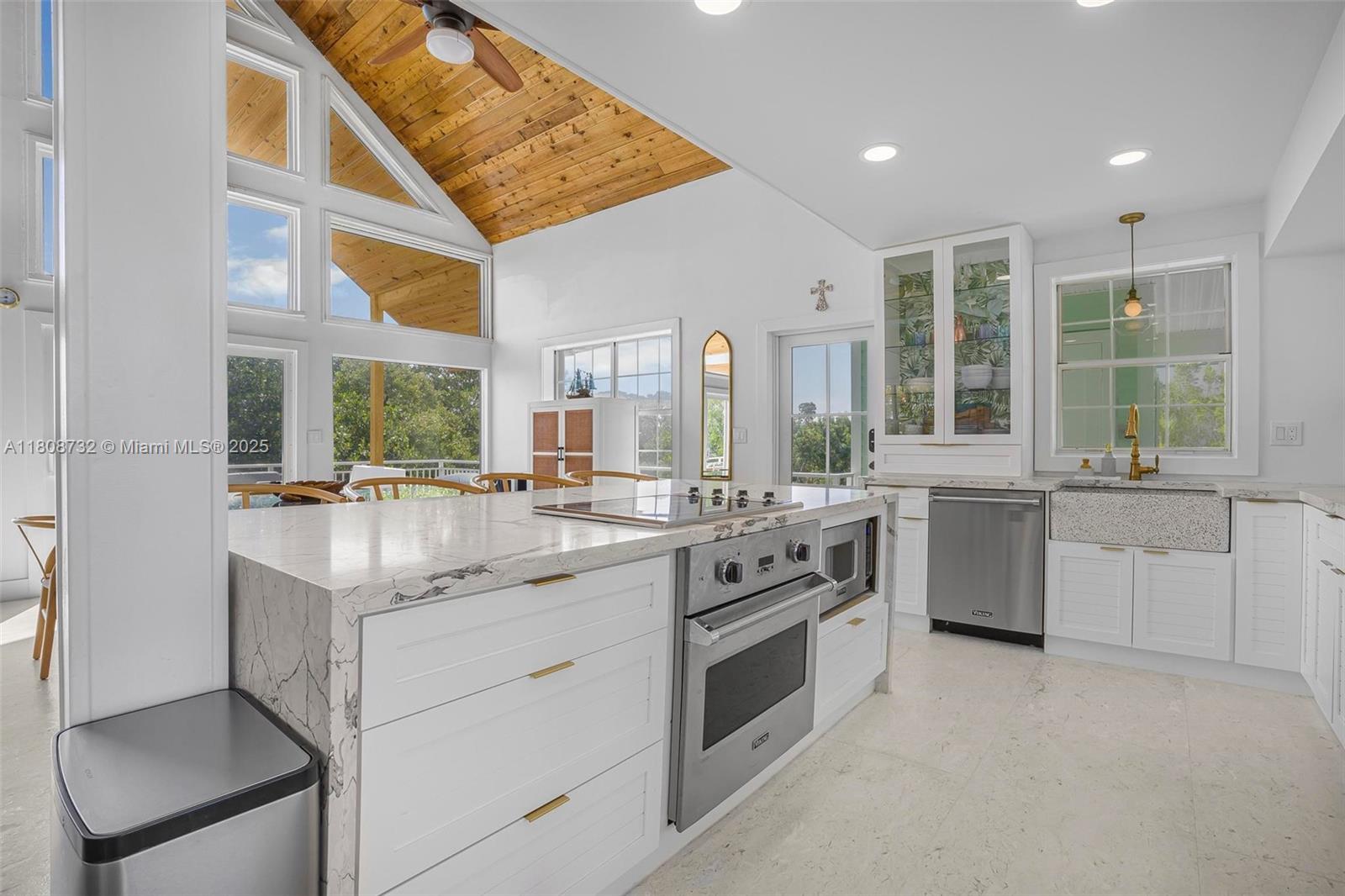 41 Mutiny Place Key Largo, FL 33037 - Photo 21 of 69 a kitchen with white cabinets and white appliances