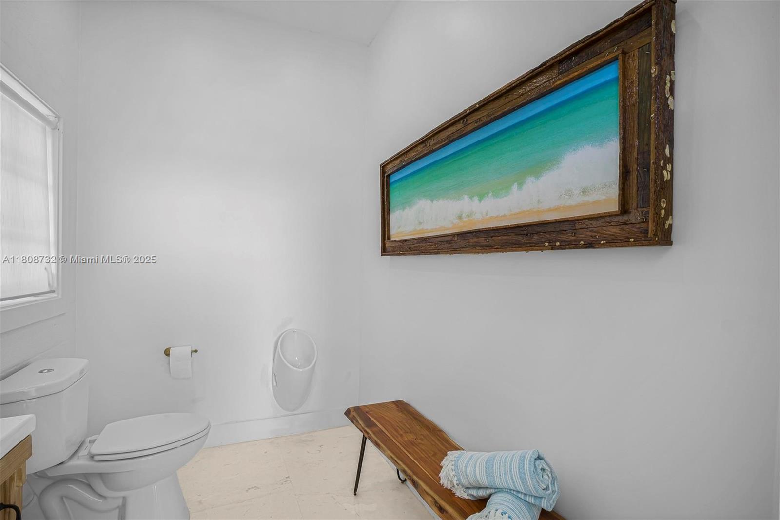 41 Mutiny Place Key Largo, FL 33037 - Photo 38 of 69 a bathroom with a toilet and a sink