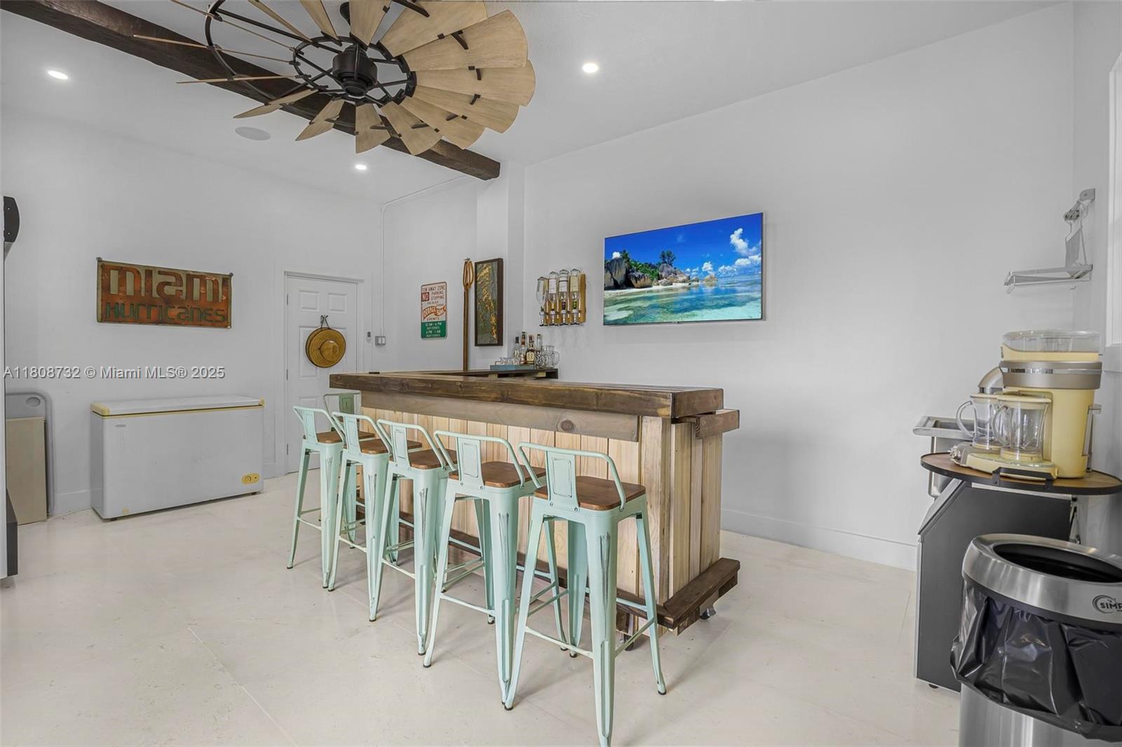 41 Mutiny Place Key Largo, FL 33037 - Photo 41 of 69 a dining room with furniture and a flat screen tv
