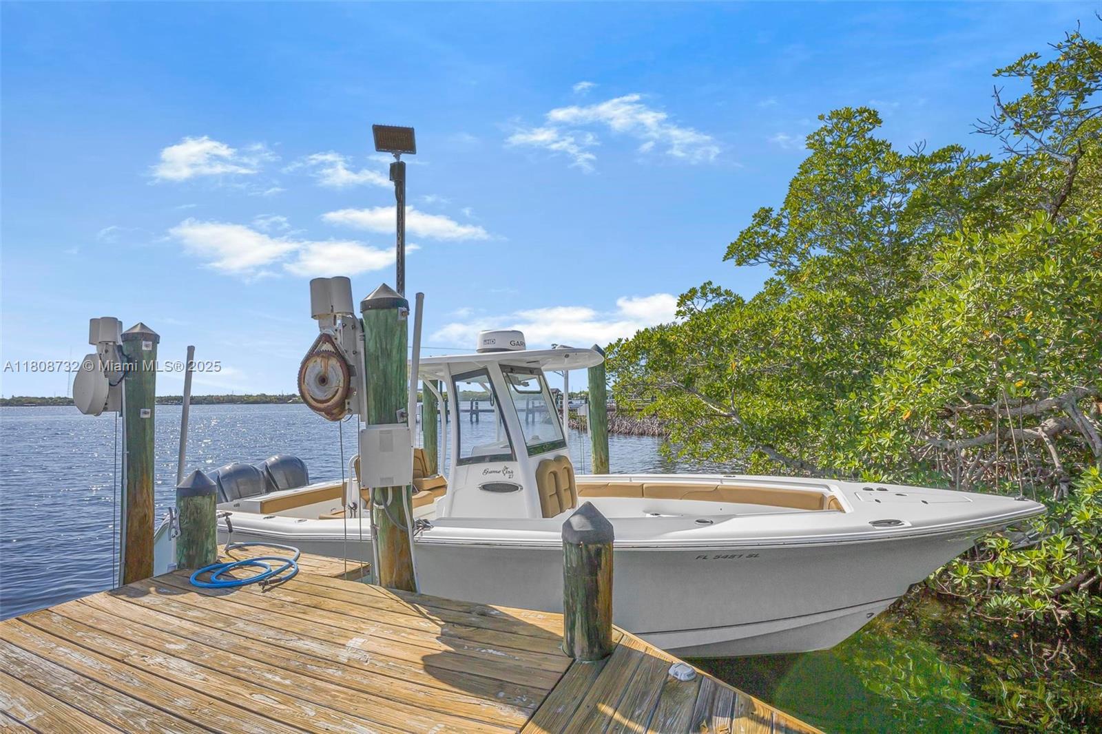 41 Mutiny Place Key Largo, FL 33037 - Photo 49 of 69 a view of a swimming pool with a patio