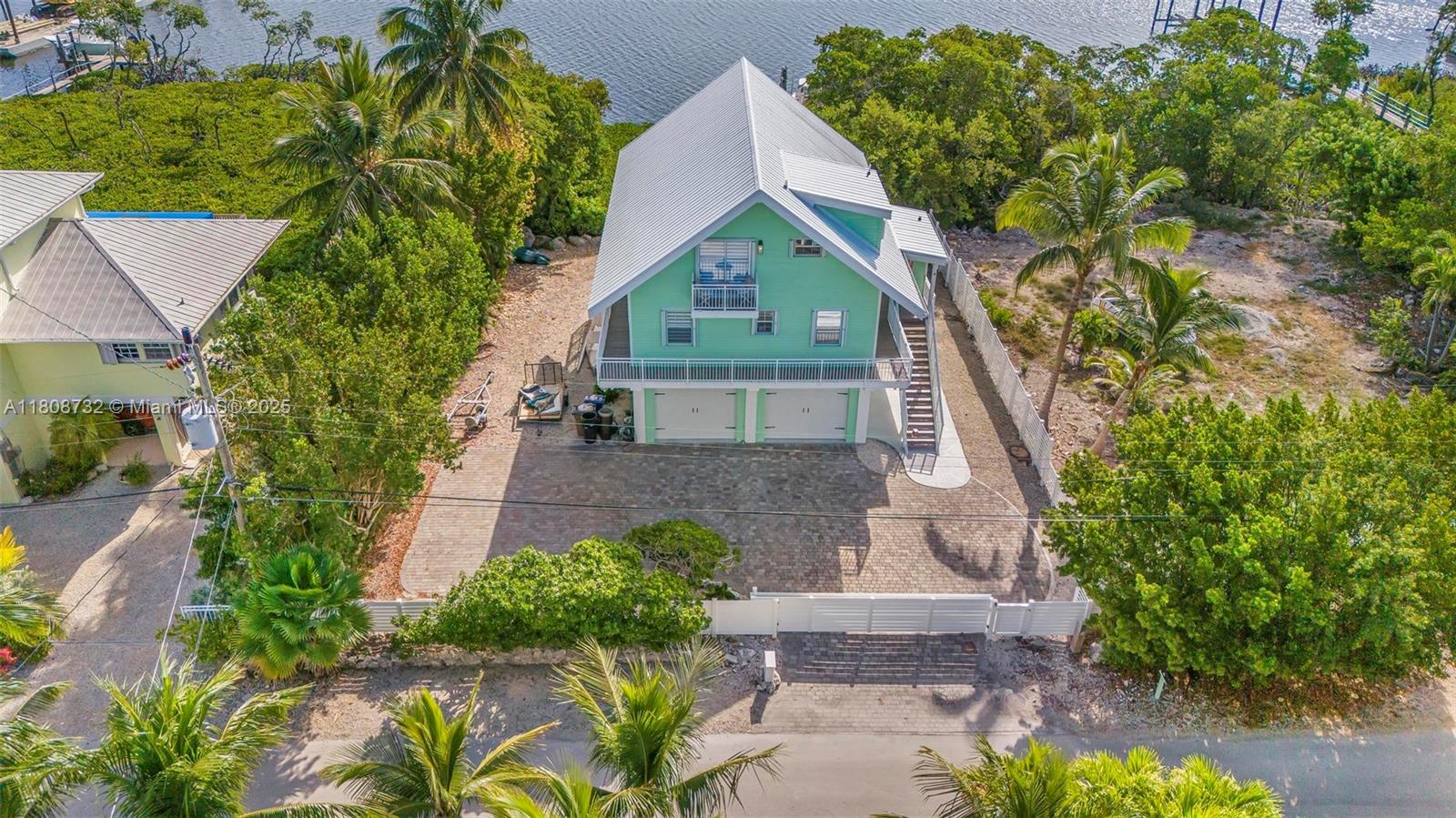 41 Mutiny Place Key Largo, FL 33037 - Photo 54 of 69 an aerial view of a house with a yard and potted plants