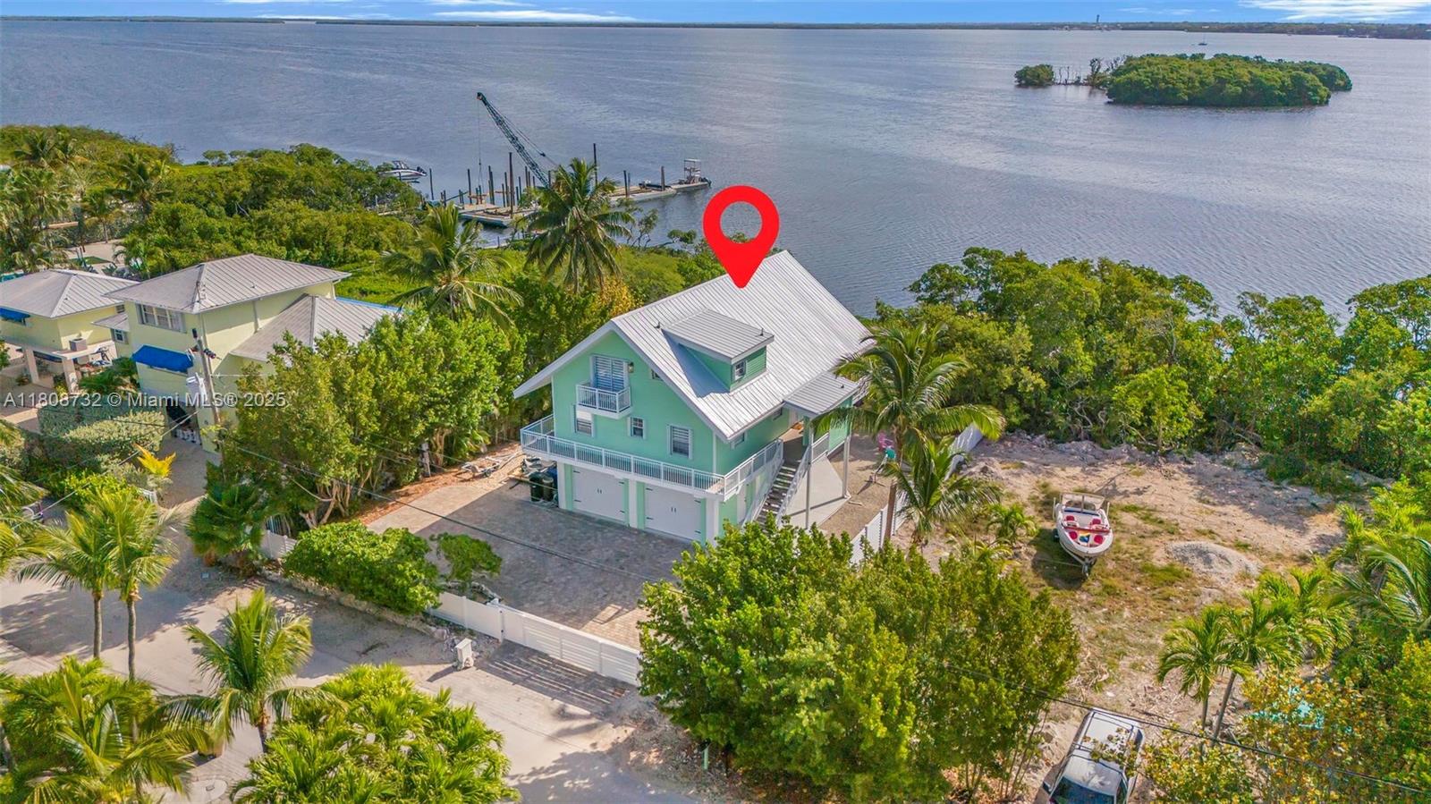 41 Mutiny Place Key Largo, FL 33037 - Photo 56 of 69 an aerial view of residential house with outdoor space and parking
