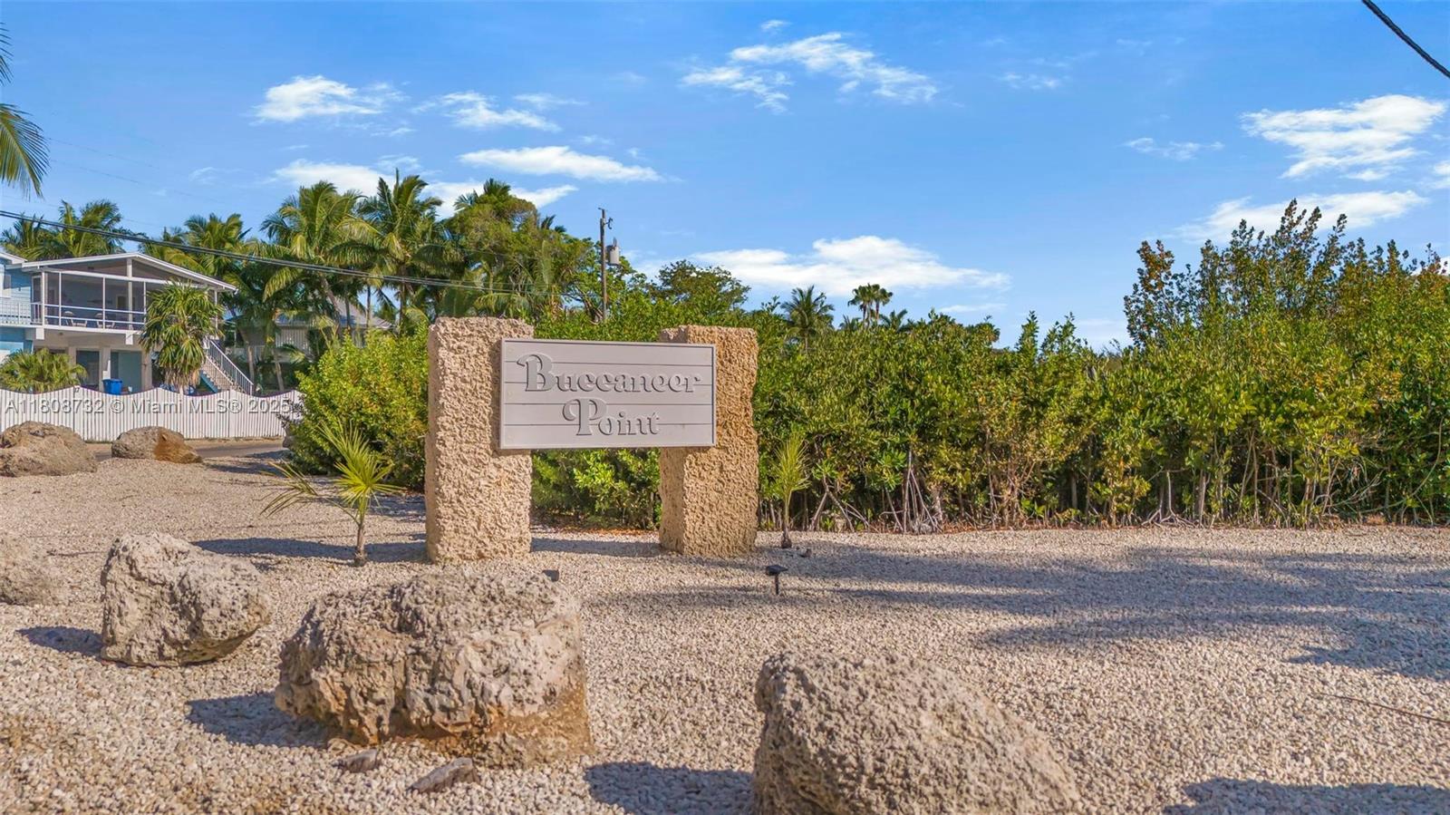 41 Mutiny Place Key Largo, FL 33037 - Photo 66 of 69 a view of a entrance gate of the house and trees