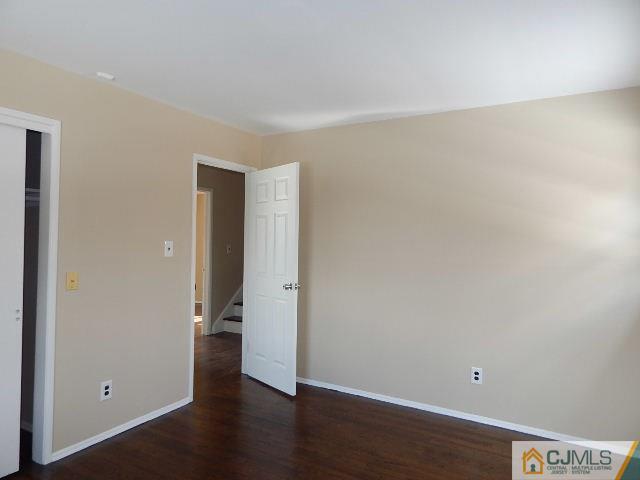 5 Amman Road Edison, NJ 08817 - Photo 22 of 24 a view of a room with wooden floor