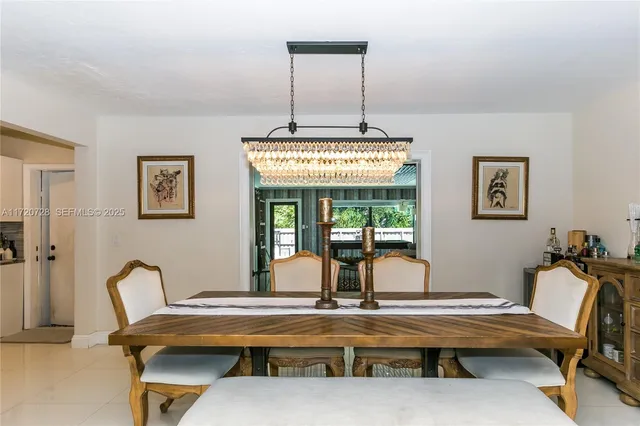 a bathroom with a granite countertop sink a mirror and shower