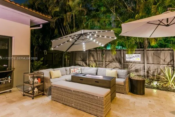 a outdoor space with patio the couches and a potted plant on the patio