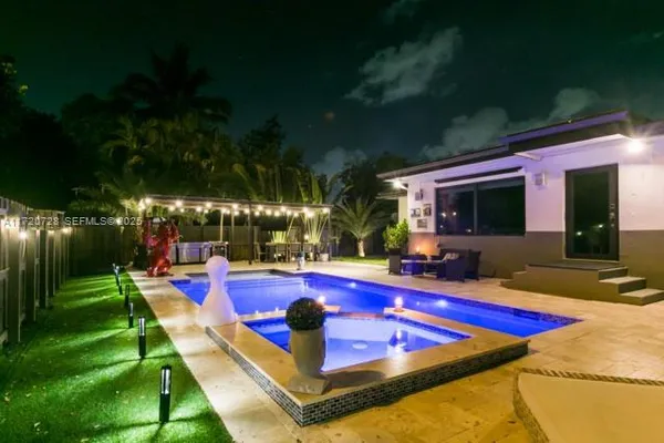 a view of swimming pool and seating space