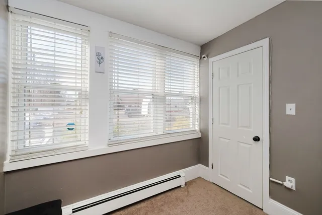 a view of a room that has a window in it