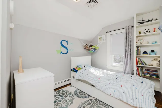 a bedroom with a bed and a cabinets