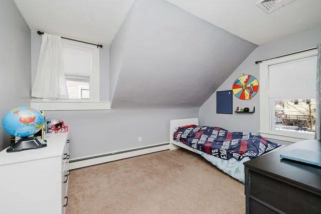 a bedroom with a bed and cabinets