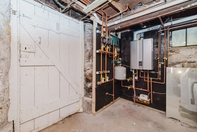 a view of walk in closet with clothes