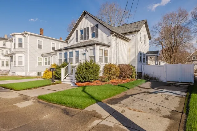 front view of a house with a yard