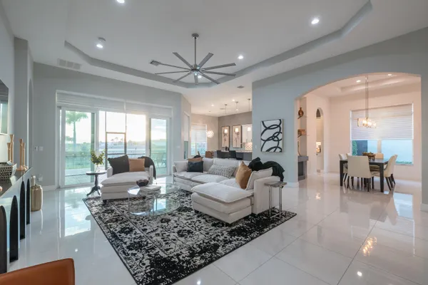 a large kitchen with kitchen island a sink a counter space and stainless steel appliances