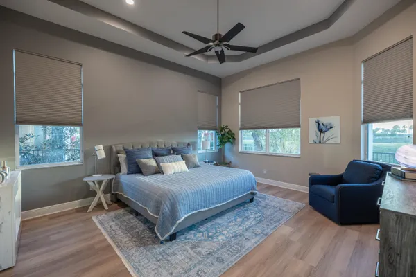 an aerial view of a house with a garden and swimming pool