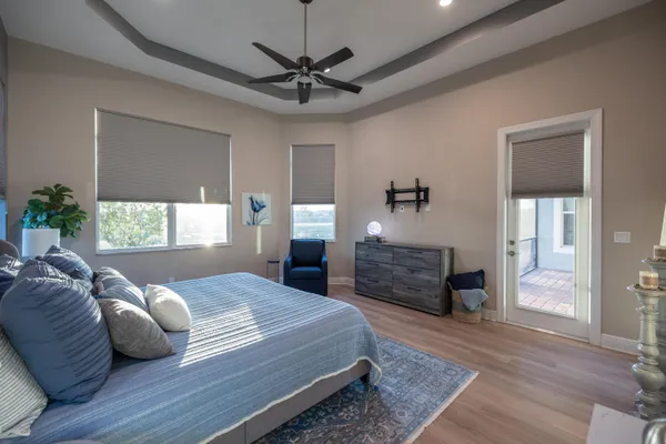 an aerial view of lake and residential houses with outdoor space