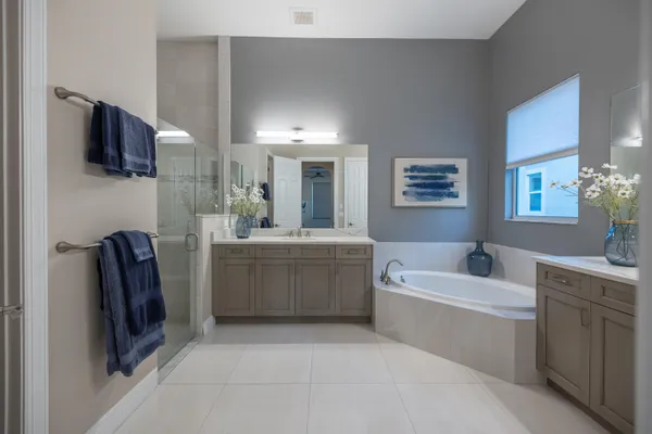a living room with furniture a rug and a chandelier