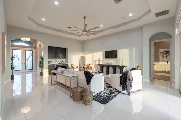 a large kitchen with kitchen island granite countertop a large counter top cabinets and stainless steel appliances