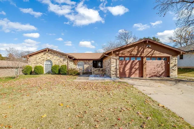 a view of a house with a snow on the road