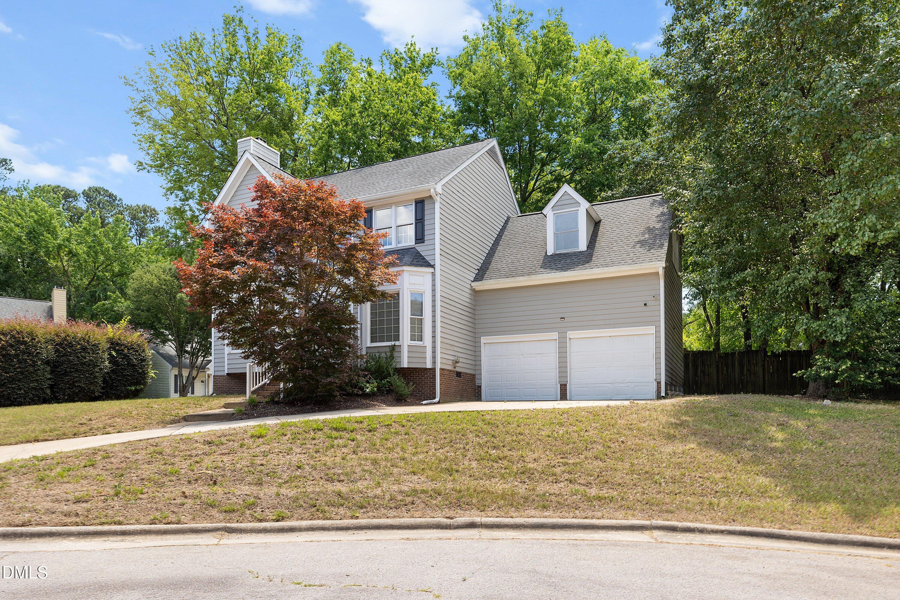 2517 Birchford Court Raleigh, NC 27604 - Photo 3 of 63 a front view of a house with a yard