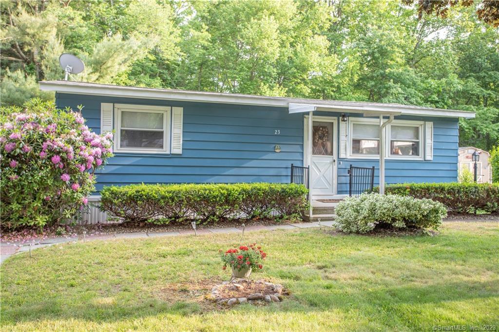 23 Stone Hedge Road Westbrook, CT 06498 - Photo 1 of 1 a front view of a house with garden