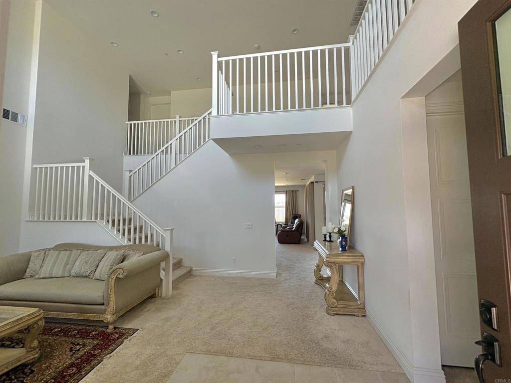 39529 Dayspring Way Temecula, CA 92591 - Photo 4 of 49 a view of a bedroom with furniture and staircase