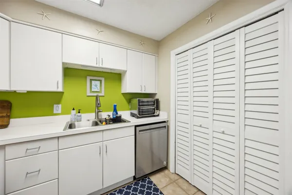 a kitchen with a sink and cabinets