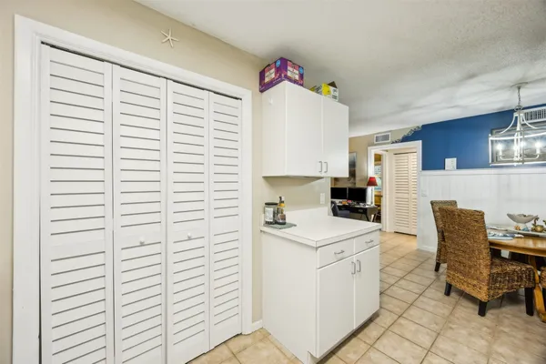 a kitchen with a white cabinets and white appliances