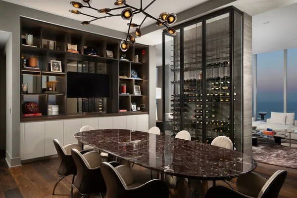 a outdoor dining space with furniture and view of kitchen